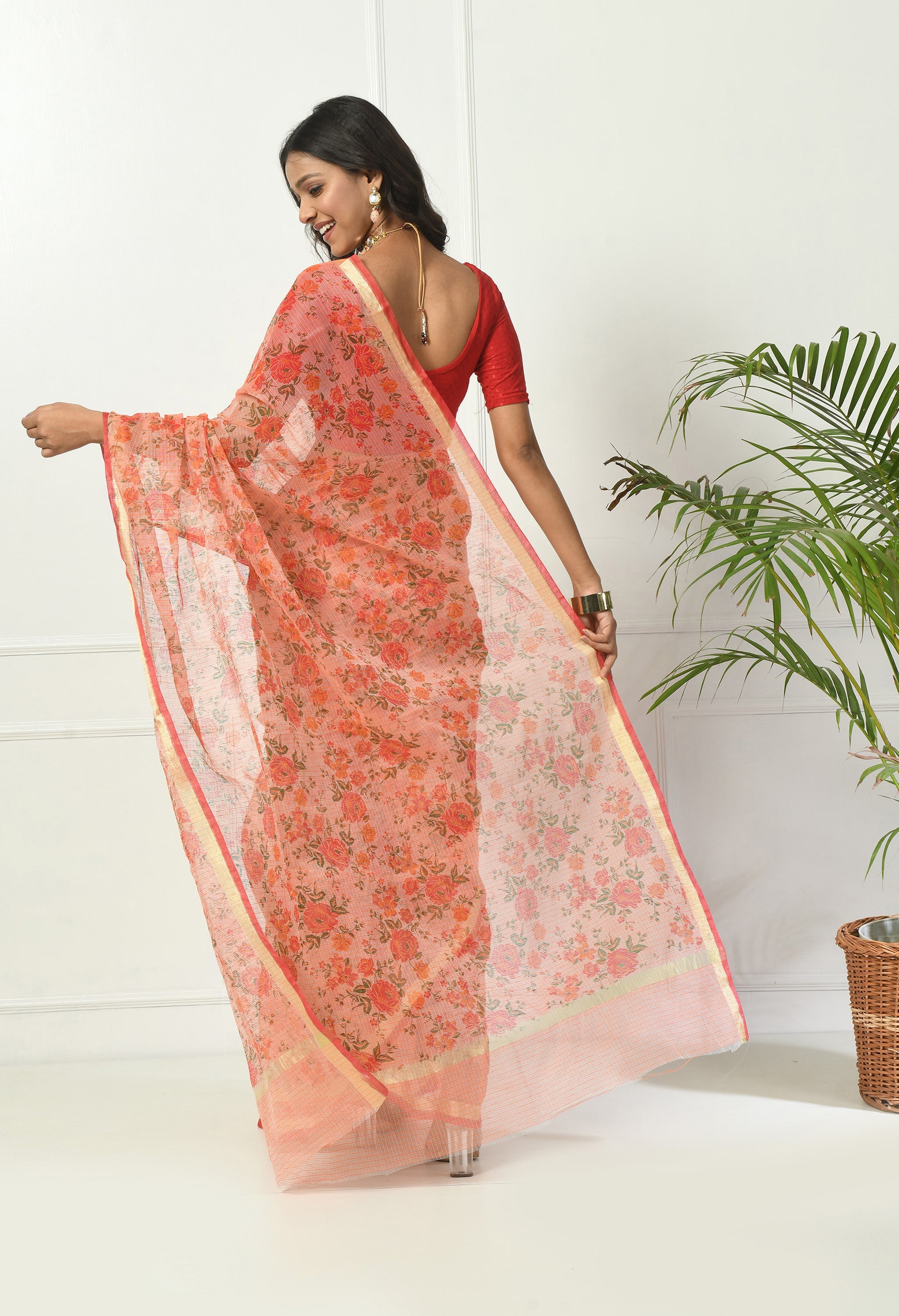 Sunset Orange Cotton Saree with Floral Pattern